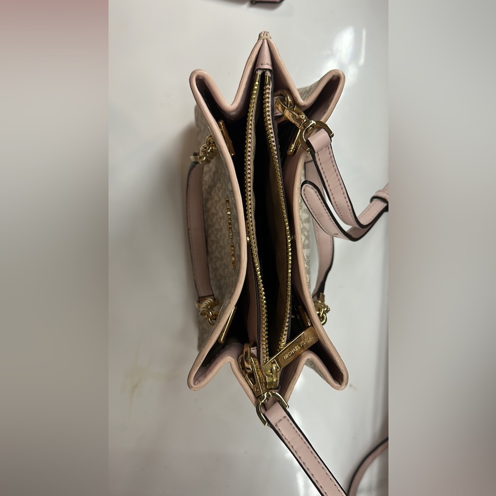 Pink, white, and grey Michael kors purse